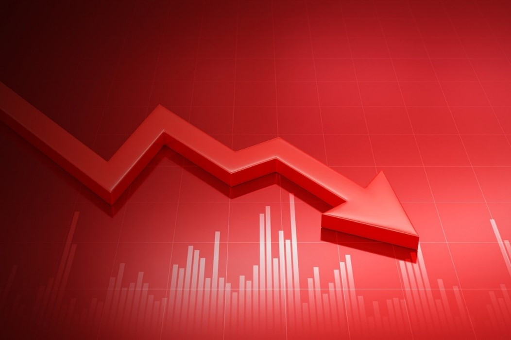 A downward trending red arrow on a red background, with a bar chart representing declining values below it.