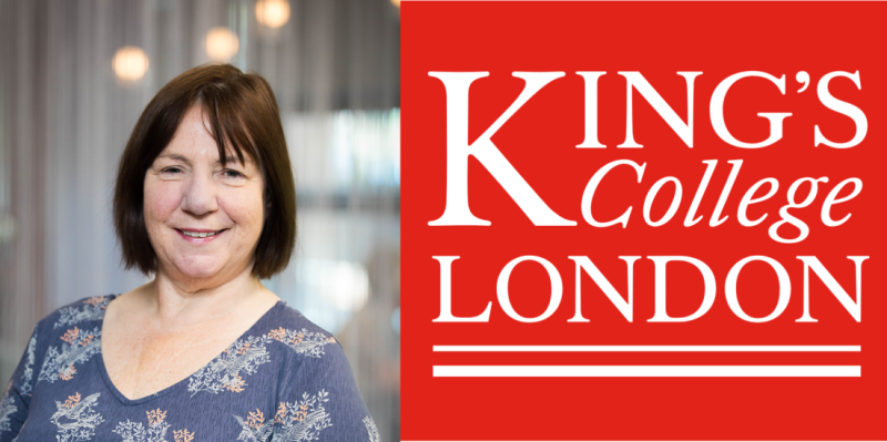 A woman with shoulder-length brown hair smiles in front of a blurred background. Beside her is a large logo for King's College London in red and white.