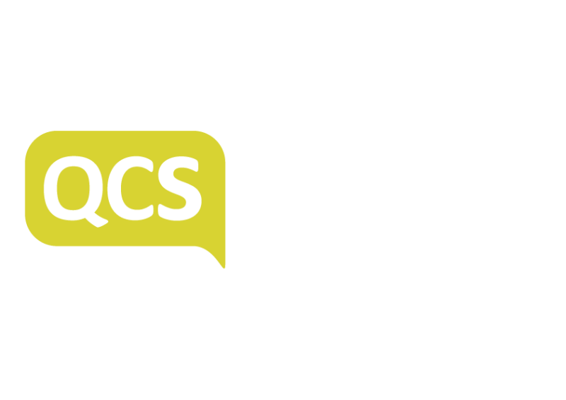 A yellow speech bubble logo featuring the letters "QCS" in white, with the rest of the text in a modern font. The background is solid white.
